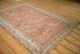 Blush and beige distressed Oushak rug with interconnected botehs and germinating blossom border.