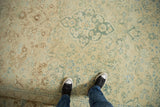 Distressed vintage Turkish Isparta carpet, faded floral motifs on abrashed ivory ground.