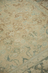 Distressed texture, faded ivory and pale green floral motifs on a vintage Turkish Isparta rug.