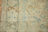 Distressed Isparta carpet pile showing faint foundation, faded ivory, and ocean green motifs.