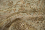 Distressed pile texture with time-softened earth tones on this vintage Oushak carpet.