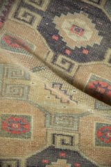 A detailed shot of the vintage Kars rug's sandy, hand-knotted texture and even, low pile.