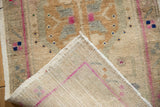 Distressed Oushak rug pile texture with beige, oxidized silver, magenta, and hand-knotted reverse.