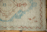 Even wear and hand-knotted texture of a distressed Turkish Oushak rug's low pile.