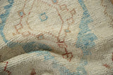 Hand-knotted pile of a distressed Oushak rug showing even wear to the knot heads.
