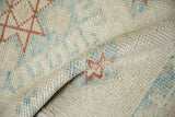 Even wear across the knot heads of a distressed Oushak rug, revealing its hand-knotted texture.