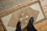 Vintage distressed Kars rug: abrashed ivory and coffee brown field, distinct stepped contour.