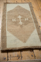 Distressed Kars rug corner, showcasing short pile texture and ivory to coffee brown contrast.