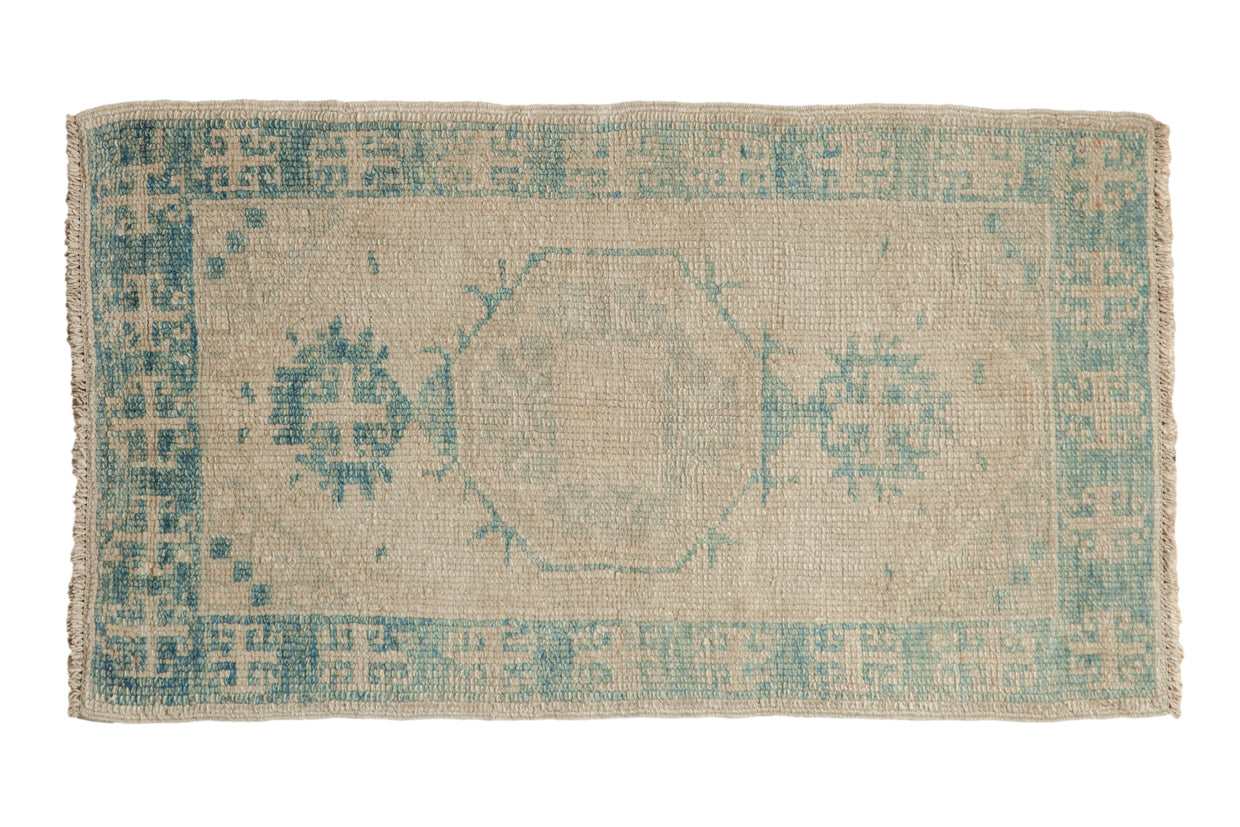 Distressed Turkish Oushak runner with faded sky blue hexagonal medallion on antique ivory, 2'3