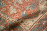 Low pile texture and decorative wear of a distressed Oushak rug in red and blue.