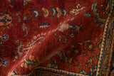 Plush hand-knotted pile of a vintage Sarouk rug in rich burgundy and blue.