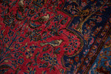 Finely woven perched birds and floral sprays on the raspberry red field of an antique Sarouk.