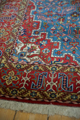 Tight weave and short pile on a vintage Persian Qom rug with red and sky blue patterns.