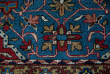 Tight weave and geometric flower heads on a vintage Persian Qom rug.