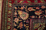 Intricate floral rosette and scrolling vine borders on a fine antique Isfahan rug corner.