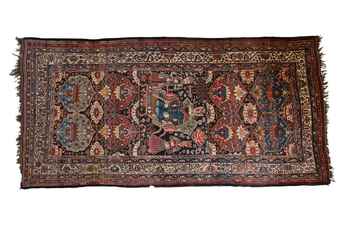 Collector's antique Afshar rug runner with a central pictorial tableau flanked by stylized floral medallions.