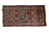Collector's antique Afshar rug runner with a central pictorial tableau flanked by stylized floral medallions.