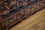 Malayer rug, geometric floral border, navy field, tomato red botehs, aged selvage.