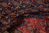 Antique Malayer rug's navy field of botehs and bold tomato red geometric border.