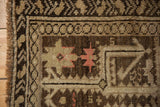 Intact side cord and even, low pile wear on a hand-knotted antique Caucasian rug.