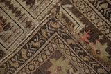 The hand-knotted foundation and restored side selvage of an antique Caucasian rug corner.