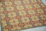 Richly detailed botanical motifs creating a kaleidoscopic effect on the antique textile.