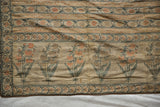 Close view of the stylized poppy motifs and striped patterns on an 18th-century Persian brocade sash.