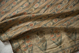 Finely rendered striped and stylized poppy motifs on the antique brocaded silk sash.