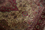 Intricate boteh and arabesque patterns showing the fine, low pile of an antique Mohtashem silk rug.