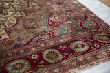 A supple fold of an antique silk Mohtashem Kashan reveals its fine, dense weave.
