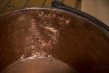 Detail of the hand-braised dovetail seam inside the antique hammered copper kettle.