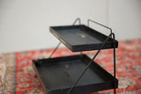 Side view of the black metal Philco stand with its gold 