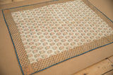 Antique 17th Century Persian brocade textile; delicate floral patterns, ornate border, blue edge.