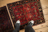 Antique Farahan Sarouk rug mat shown side-by-side with its similar twin for design comparison.