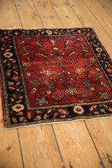 High-angle perspective of the antique Farahan Sarouk mat, showing its intricate tree of life design.
