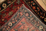 Hand-knotted foundation visible on the reverse corner of an antique Farahan Sarouk rug.