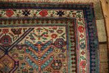 Fine weave of an antique Serab's border with its reciprocating pawn design motif in gem tones.