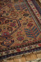Fine wool pile of an antique Serab showing geometric finned fern and pawn motifs.