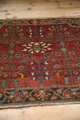Angled view highlighting the time-softened, oxidized wool tips on a vintage Farahan Sarouk rug.