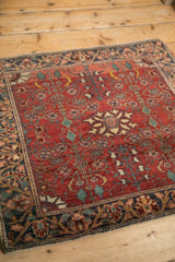 Time-softened wool pile and visible knot heads on the corner of a vintage Farahan Sarouk rug.