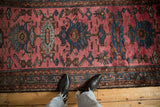 Varied pile texture of a vintage Mehriban rug with sapphire blue and chestnut floral medallions.