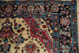 Palmette and boteh border in sky blue and raspberry on an antique Persian Mohajeran Sarouk rug.