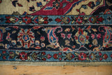 Intricate main border of an antique Sarouk, detailing the boteh motifs and intact side cord selvage.