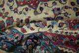 Folded antique Mohajeran Sarouk contrasting the ivory field with rich border palmettes.