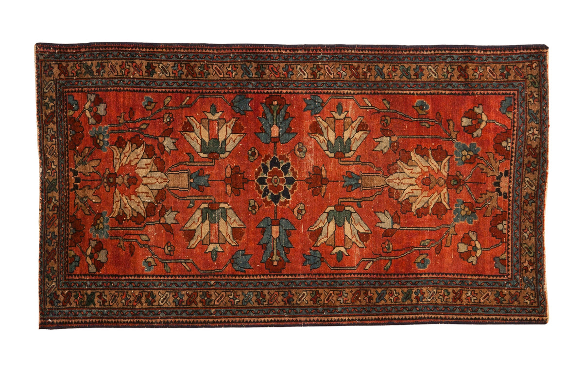 Antique Mehreban rug with large geometric palmettes in sky blue and ivory over a raspberry red field.