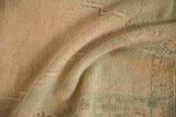 Close-up of the vintage Oushak's low pile, showing mostly even wear across the visible knot heads.