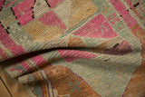 Angled view highlighting the pliable, hand-knotted texture of a vintage distressed Kars rug.