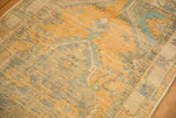 Mostly even wear across the hand-knotted pile, revealing the foundation of the vintage rug.