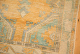 Close view of the mostly even wear and low pile on a hand-knotted vintage Oushak rug.