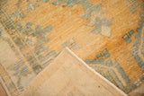 The hand-knotted reverse and secured side cord of a vintage distressed Oushak rug.